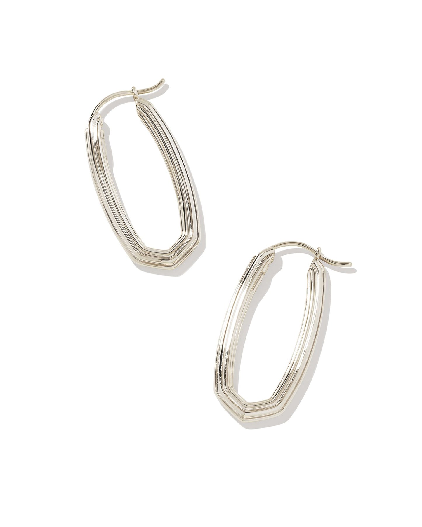Looking for a modern addition to your hoop collection? Meet the Heather Hoop Earrings. With their elongated oval shape and subtle ridged texture, these hoops have the perfect amount of contemporary flair. Silver