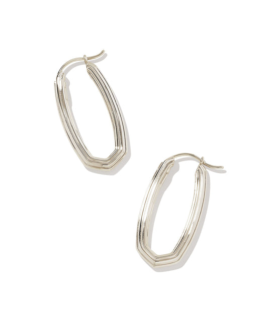 Looking for a modern addition to your hoop collection? Meet the Heather Hoop Earrings. With their elongated oval shape and subtle ridged texture, these hoops have the perfect amount of contemporary flair. Silver