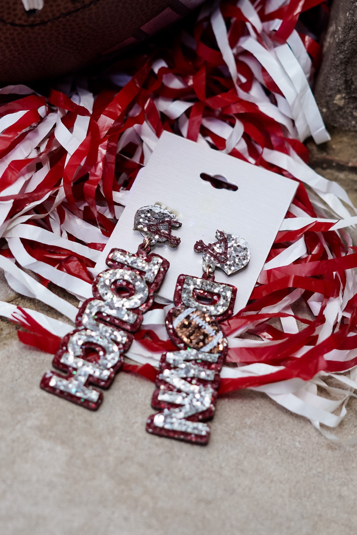 Crimson outline "Touch" and "Down" earrings with sliver wording. Sliver beaded helmets.