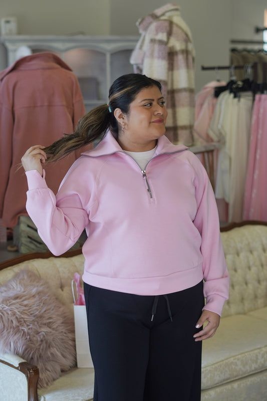Model wearing Spanx Air Essentials Quarter Zip Pullover in Light Pink (Petunia)