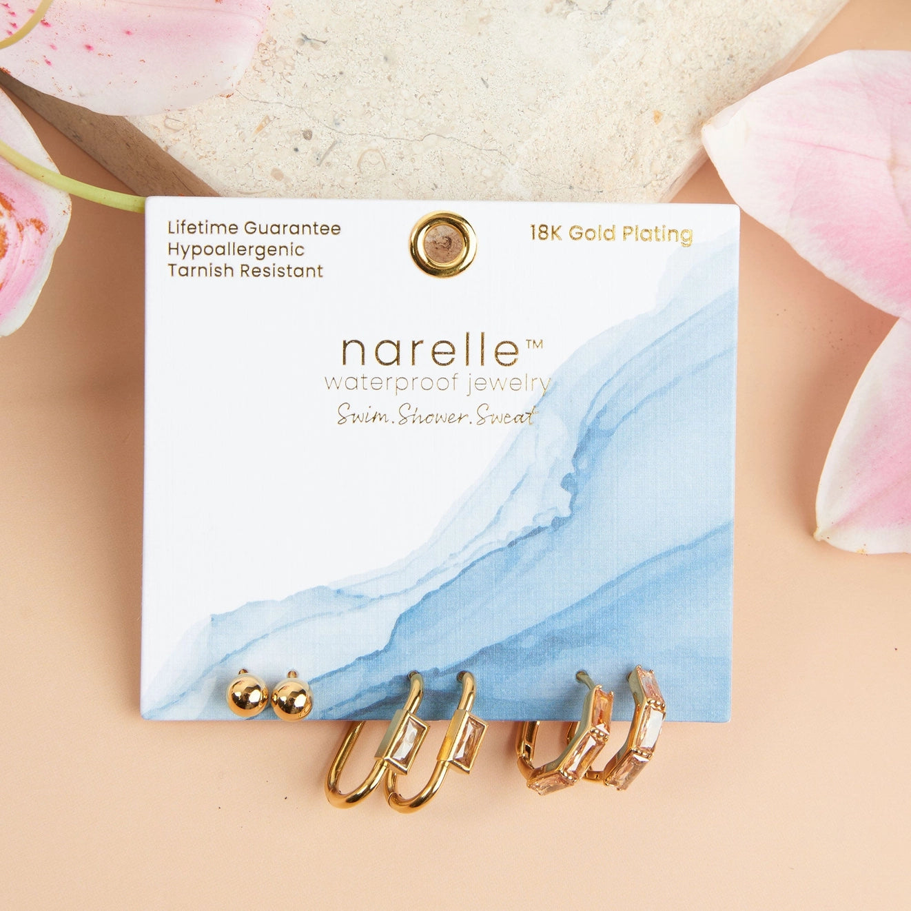 Rectangle Hoop Earring Trio offers three pairs of earrings in trendy hoop, link, and post designs, all in a classic gold.
