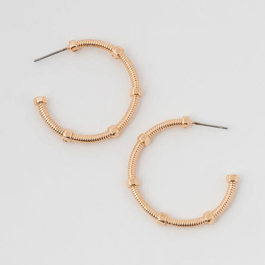 Gold classic hoop, the Medium Textured C Hoop Earrings feature a stylish fun textured design.
