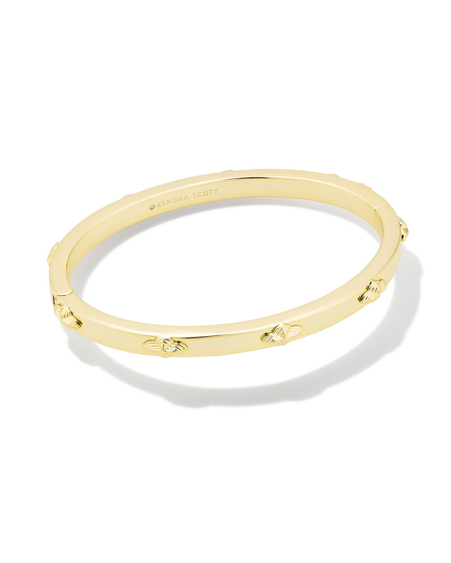 Build up your bracelet stack with the Abbie Metal Bangle Bracelet in Gold. This classic bangle features high-shine metal and a repeated motif of our Abbie shape, so it’ll pair perfectly with your other favorite bracelets.