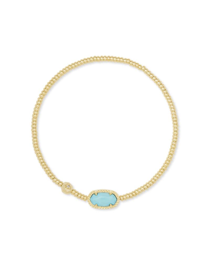 gold beaded stretch bracelet with an oval charm with a blue magnesite center