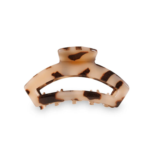 Our open hair clip offers the same incredible advantages as our classic claw clip, but with a unique open-style design that allows your hair to show through. Say goodbye to breakable clips! We have perfected the hair tie and now have re-invented the hair clip. Each clip has bendable teeth that take back to shape, they work on all hair types and have a strong hold. Hold your hair and enhance your style with the new TELETIES clip! Tortoise color