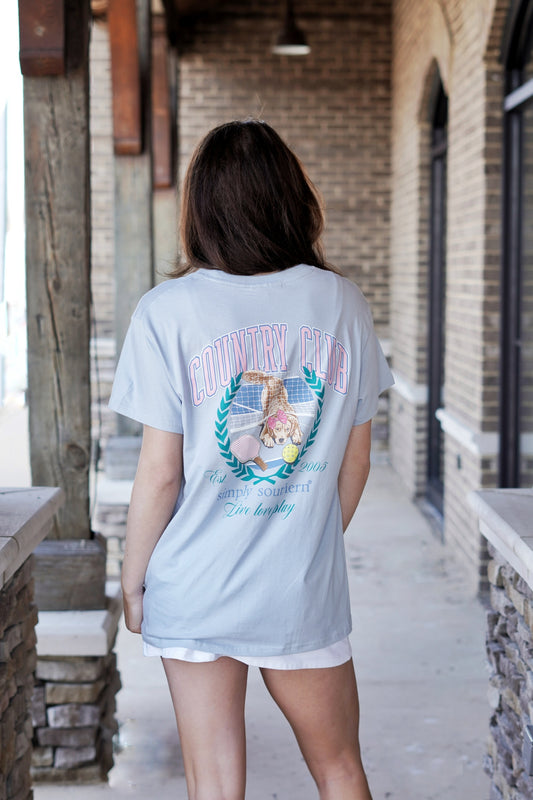 <ul> <li>Simply Southern Club-Spout T-Shirt</li> <li>Crew Neckline</li> <li>Short Sleeve</li> <li>Color: Light Blue</li> <li>Full Length</li> <li><span>Spout blue short sleeve shirt with a dog on a pickleball court and the phrases 'Country Club' and 'Live Love Play'. Simply Southern logo below and on left chest.</span></li> <li>100% Cotton</li> </ul>