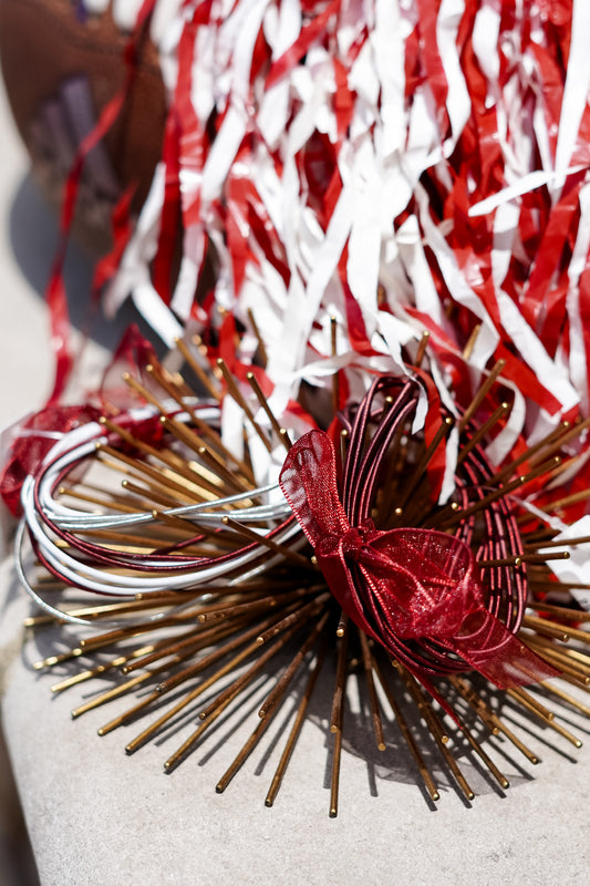 These stretch bracelets are perfect for every day wear or for game day!! With 12 individual bracelets, you can stack them or split them up!! Burgundy set and Crimson and white set.