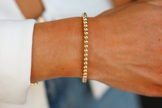 gold beaded bracelet MATERIALS: 14KG FILLED STRETCHY LENGTH: 6.5" OR 7"