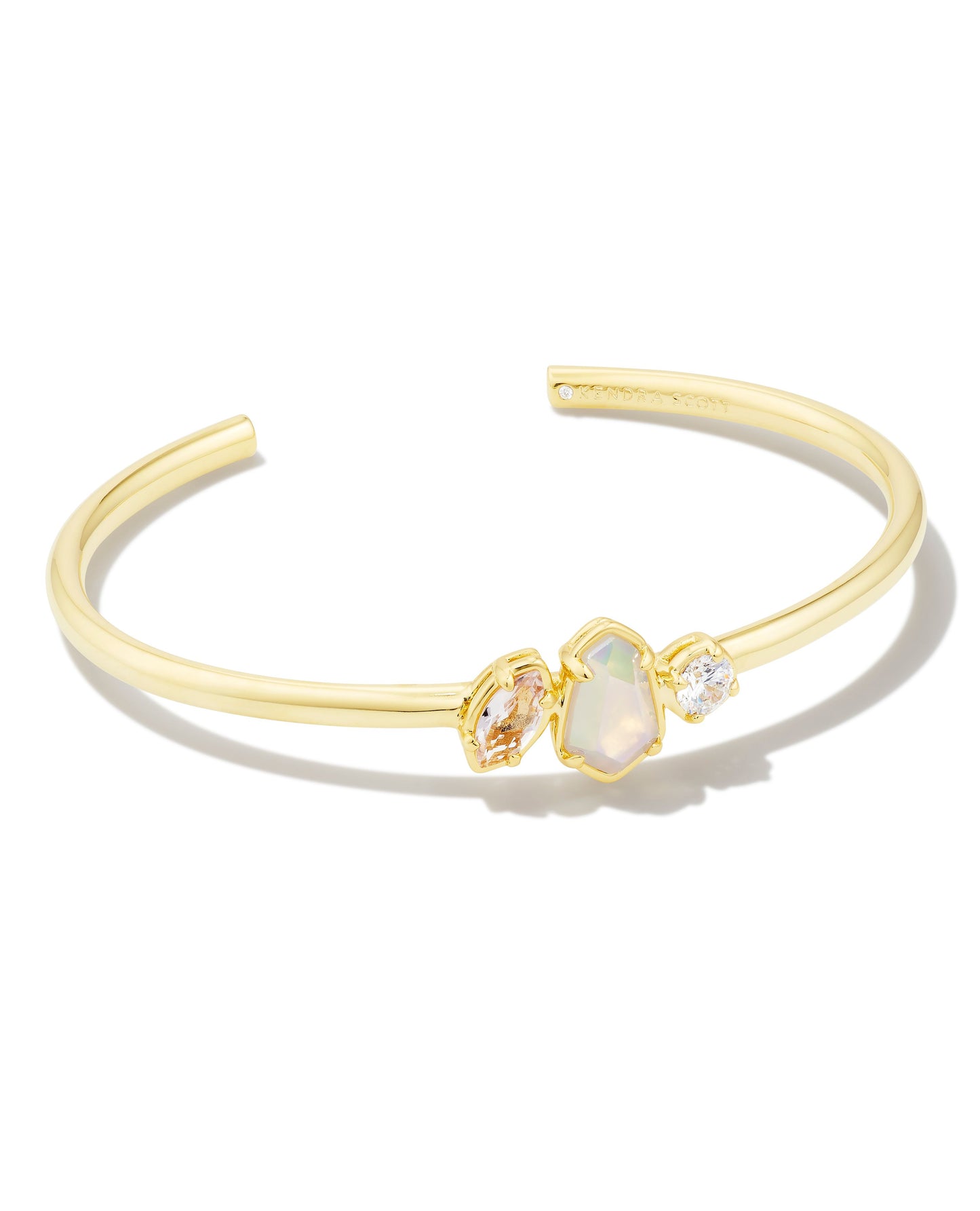 Add some shimmer to your wrist stack with the Alexandria Gold Cuff Bracelet in Neutral Mix. A trio of stones is centered along a sleek gold cuff, and the ornate prong detailing adds just a touch of edge. And with an adjustable fit, this cuff makes the perfect addition to your growing collection.