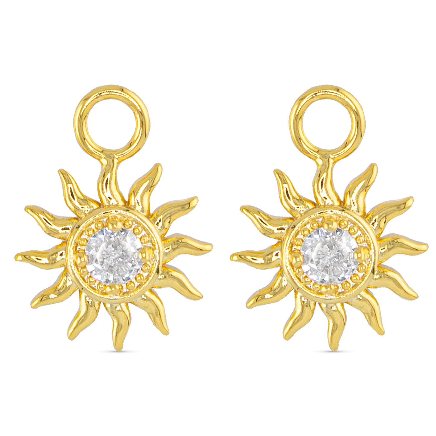 Gold earring charms in the shape of a sun with a faux crystal in the center