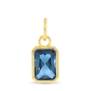 gold pendent with a blue stone