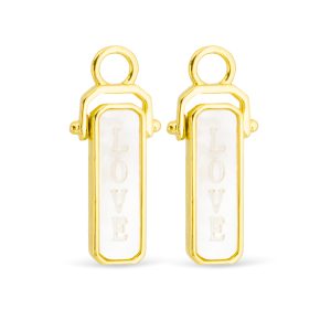 gold pendant with a white inlay featuring the word love