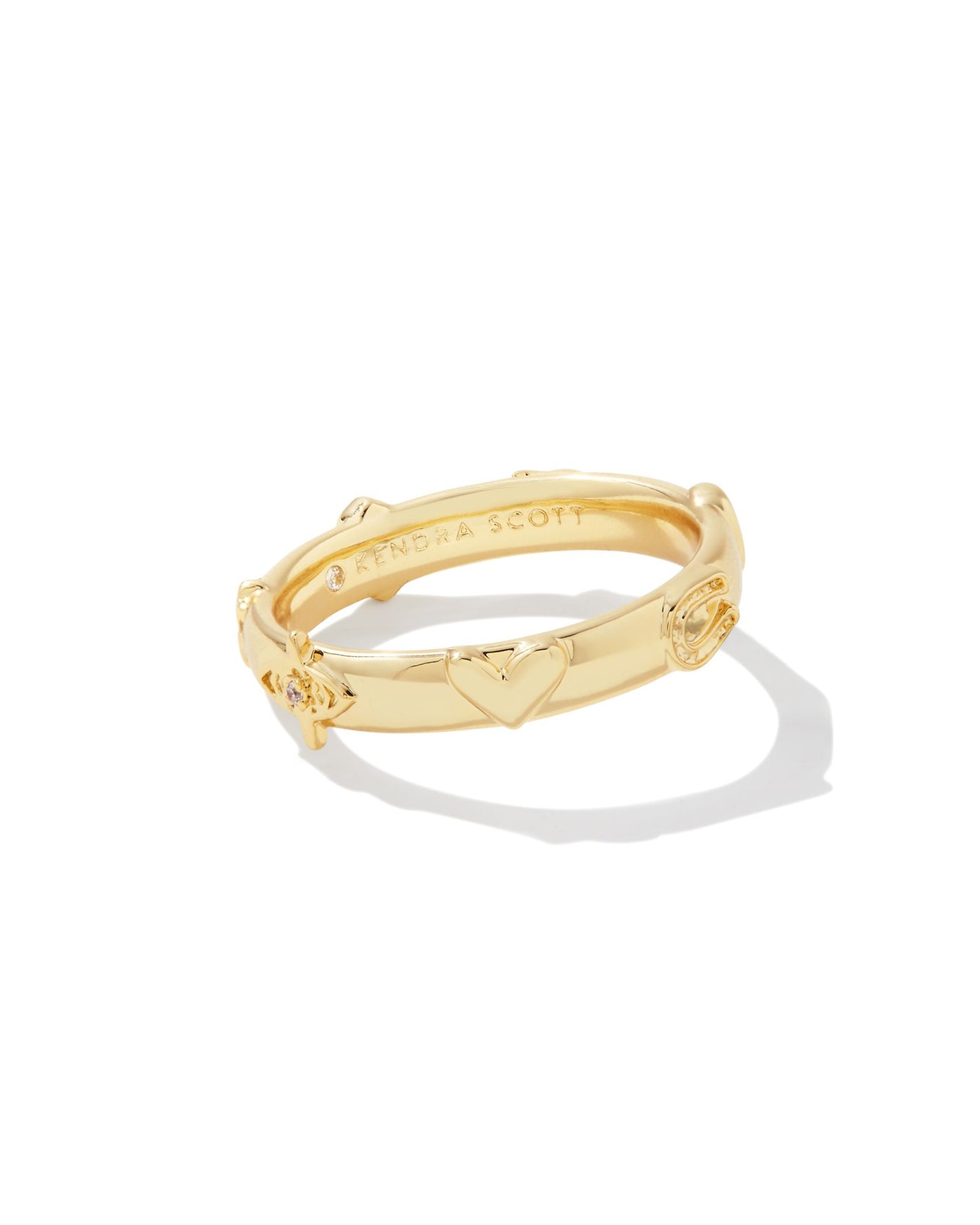 The Beatrix Gold Band Ring in White Crystal will have you charmed, we’re sure. This bold band is studded with micro charms in horseshoe, clover, heart, moon, and our signature medallion shapes. Textured and full of detail, this ring will bring you a fun, funky look (and maybe just a touch of luck).
