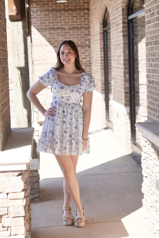 White/Blue Floral Dress, Fitted, Mid-Thigh Length, Puffed Sleeves, Round Neckline, Open Back, Tiered Style, Ties In Back