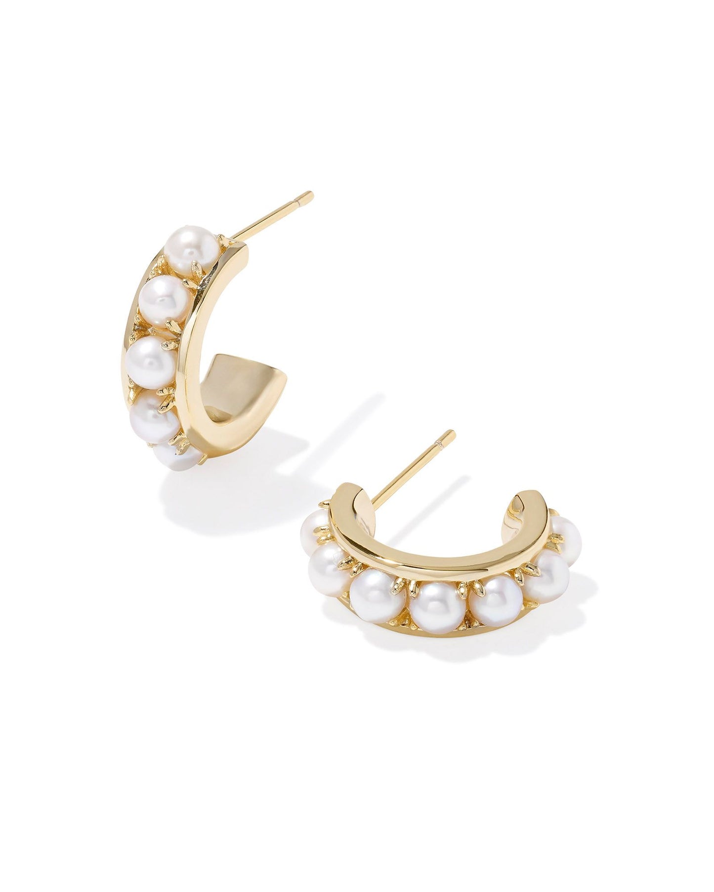 Gold earrings with pearls. 0.59' OUTSIDE DIAMETER. Ear post closure.
