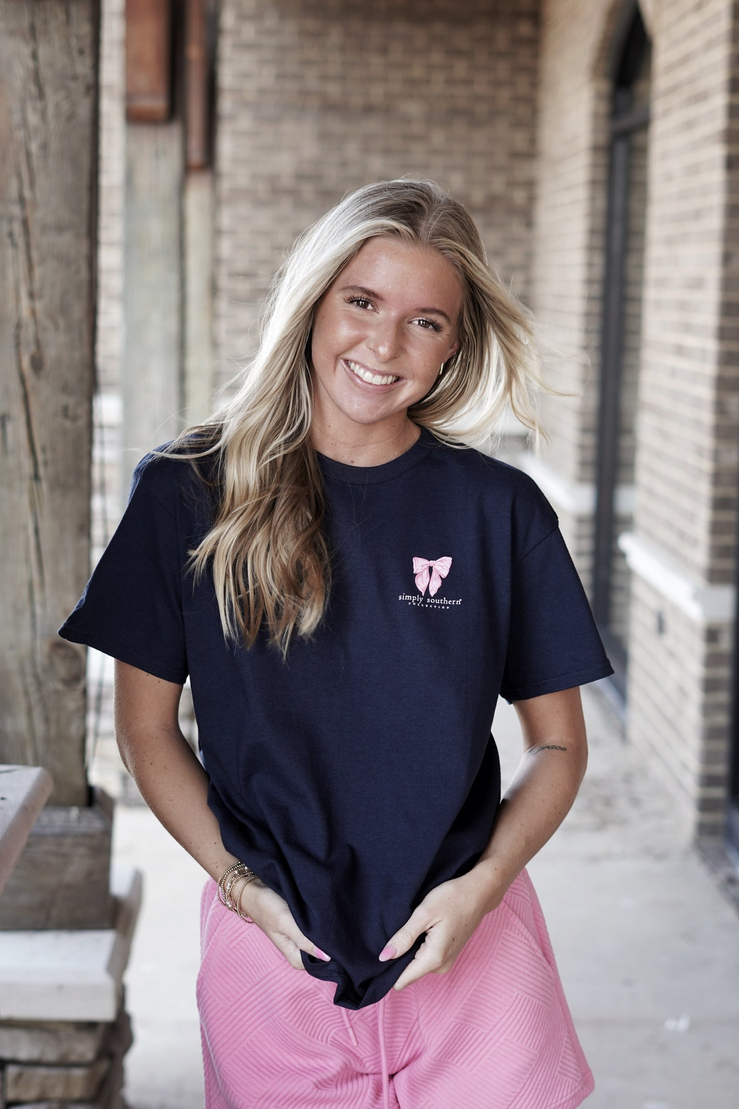 <ul> <li>Simply Southern Hair Tie T-Shirt</li> <li>Crew Neckline</li> <li>Short Sleeve</li> <li>Full Length</li> <li><span>Navy blue short sleeve shirt with the phrases 'Pursuit of Preppiness', Coquette Girl', and 'Social Club'. There are a variety of hair ties and bows. Simply Southern logo below and on left chest</span></li> <li>Color: Navy</li> <li>100% Cotton</li> </ul>
