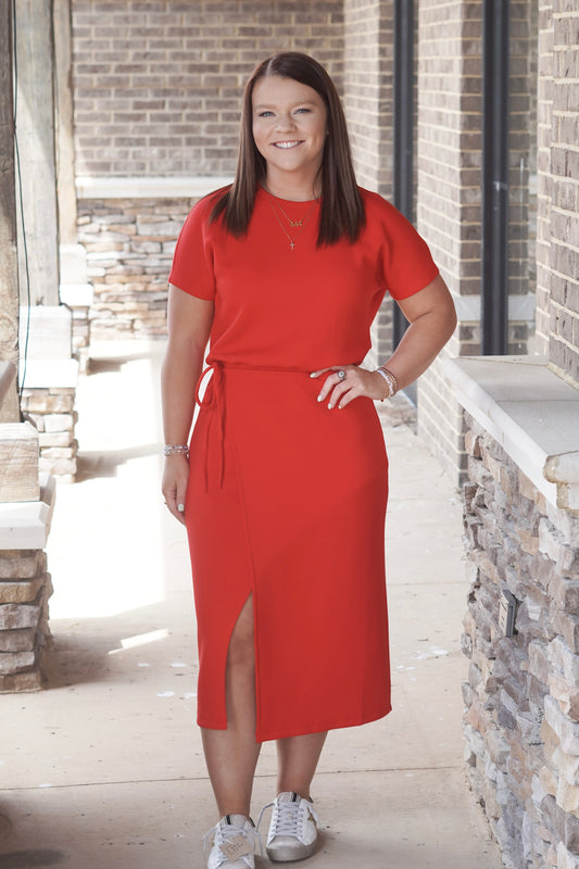 red dress, midi-length , features a tie waist , slit above the knee, short sleeve, round neckline dress.