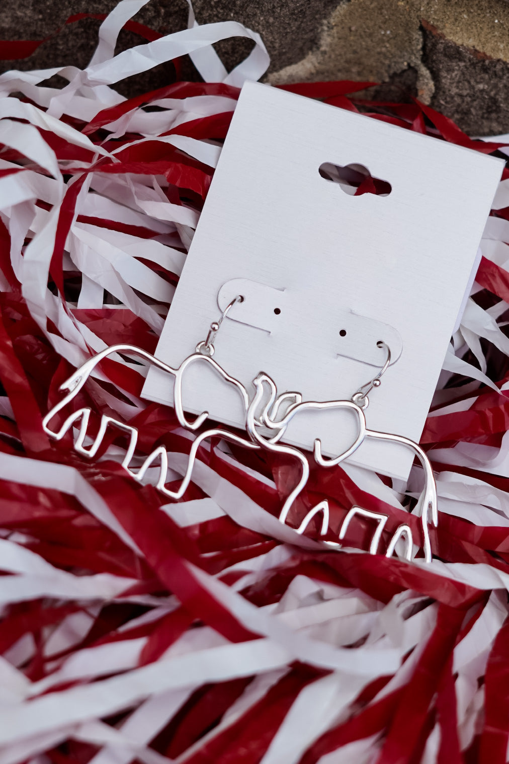 Whether you are a fan of the Tide or just love Elephants, these earrings will be a perfect addition to your outfit!! Cut Out Elephant Earrings Hook Back. Sliver wire in the shape of an elephant.