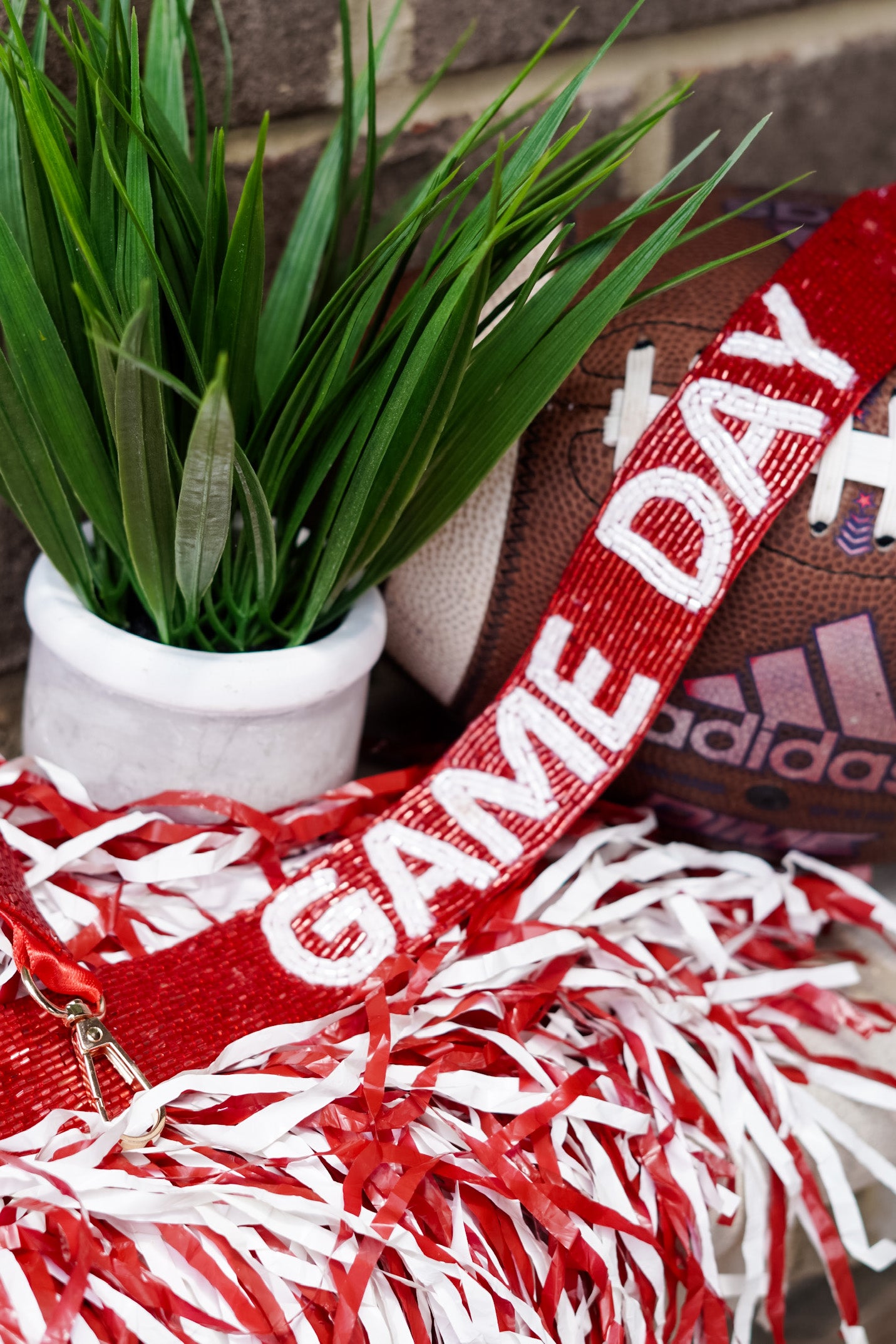 Crimson beads with white lettering that says "Game Day"