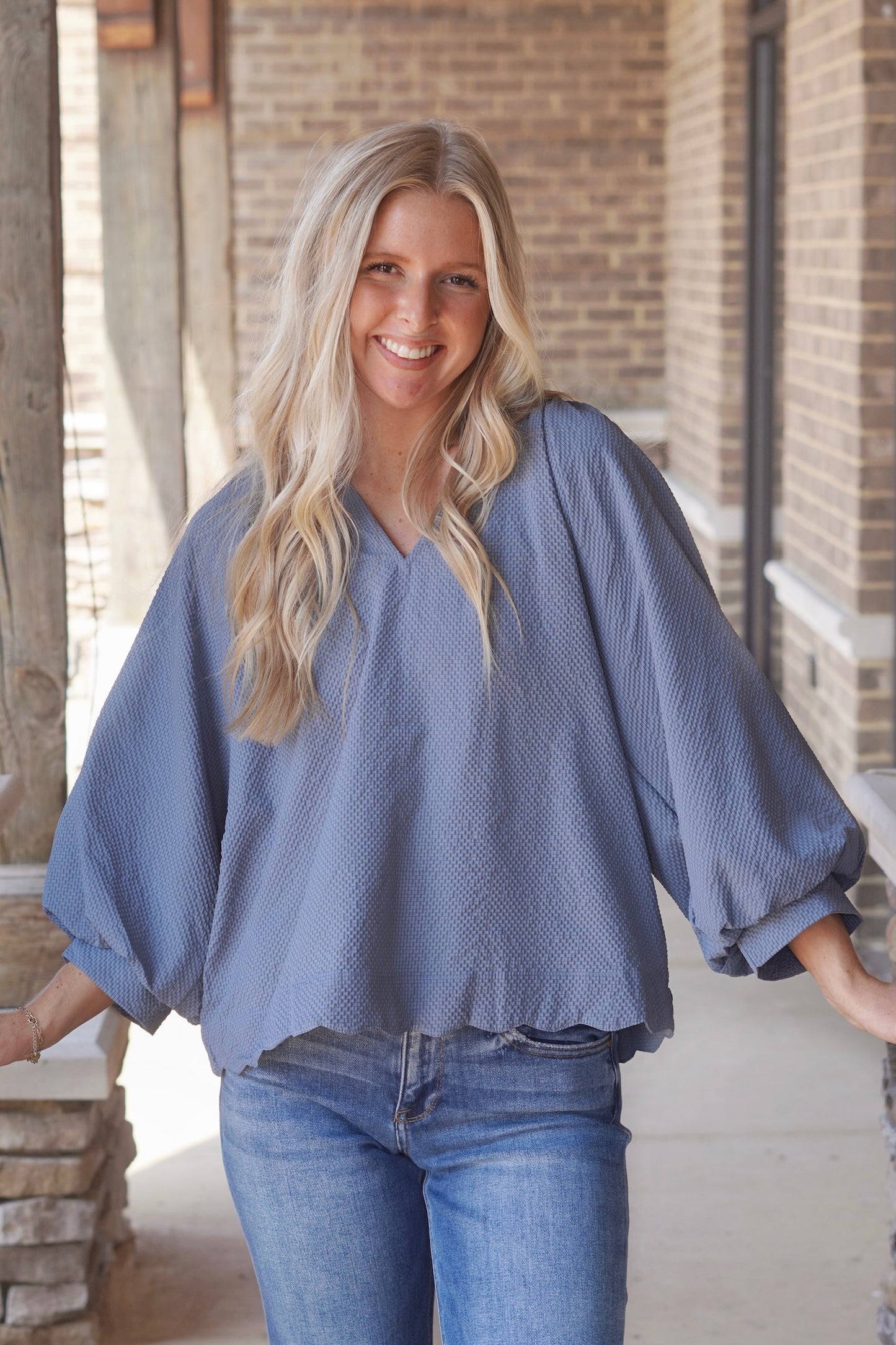 Tilly Textured V-Neck Blouse, V-Neckline, Quarter Length Sleeves, Textured Material, Scalloped Hemline, Relaxed Fit, Full Length, Color: Steel Blue