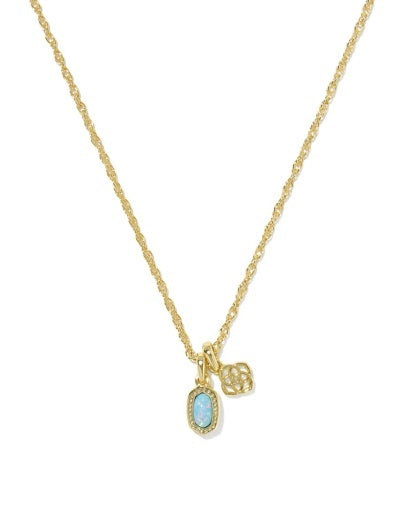 Gold necklace with a pendant that has a blue stone in a texture frame, with a Kendra Scott logo charm.