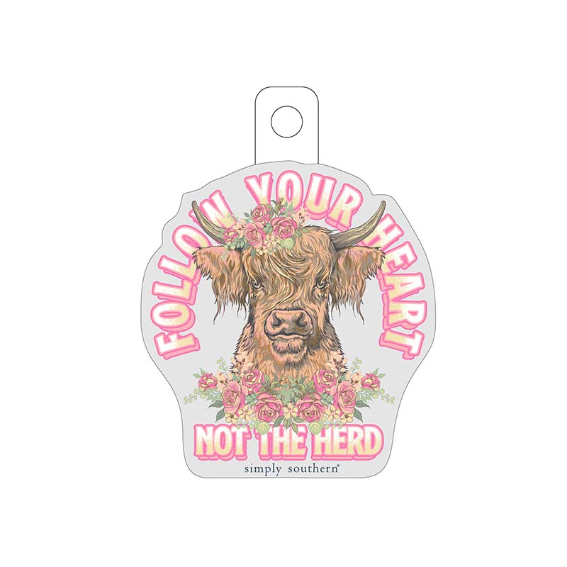 grey sticker with a cow and floral graphic with the words "follow your heart...not the herd" scripted in pink and yellow