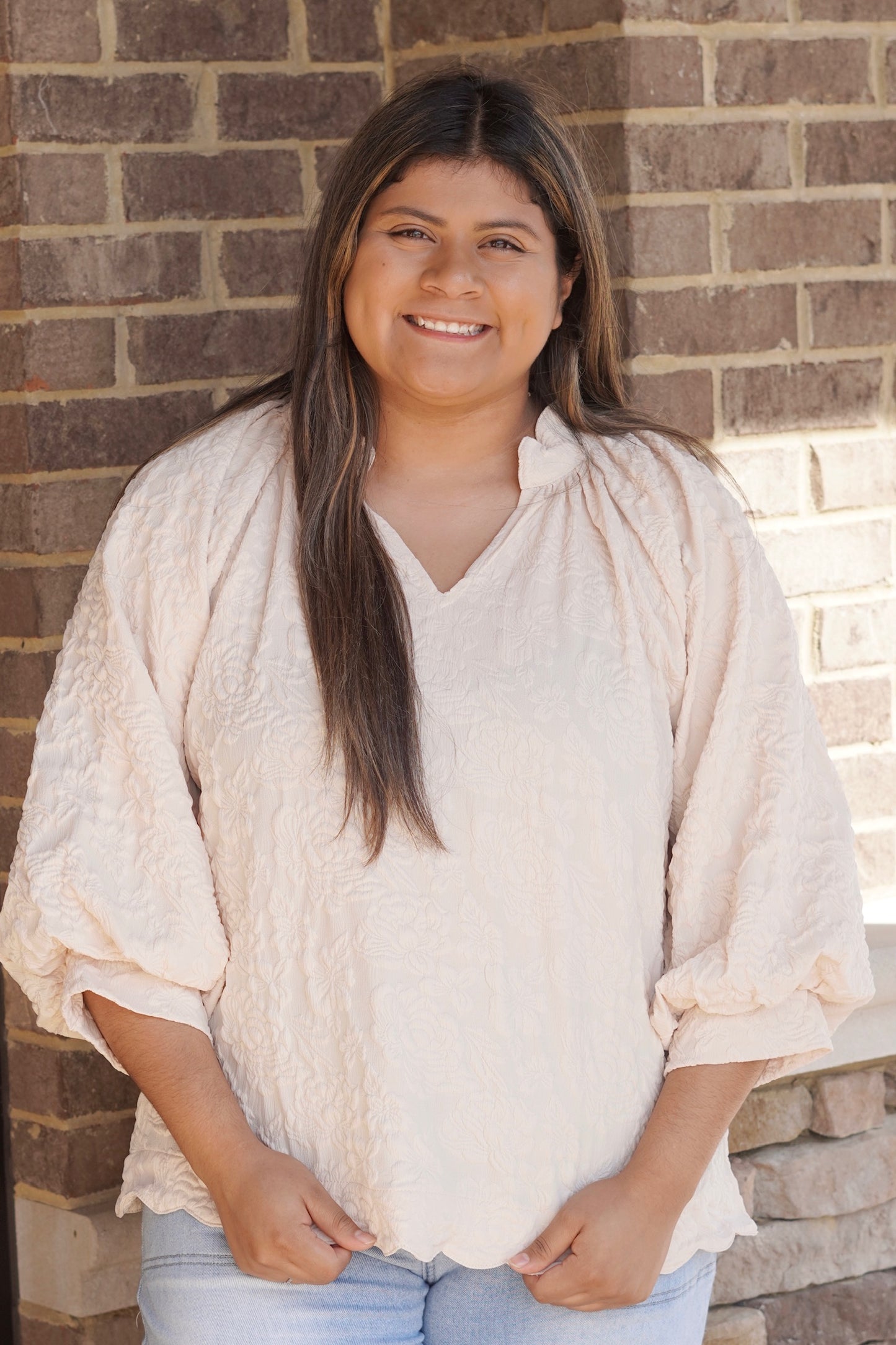 Women wearing a ivory Flowy Blouse, V-Neckline, Elbow Length Sleeves, Scallop Hemline, Full Length