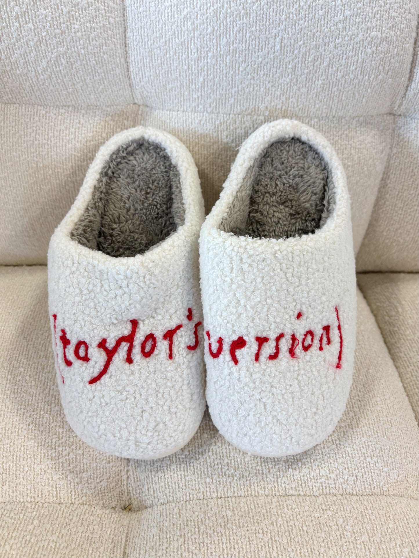 White House slippers with "Taylor version" written in red