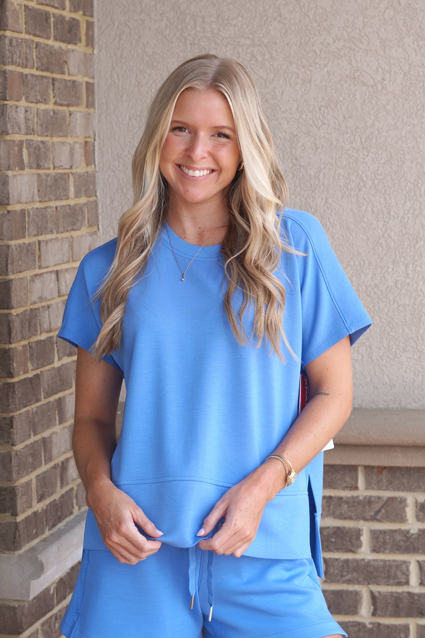 Women wearing a Blue Crewneck Tee, Round Neckline, Short Sleeve, Side Slit