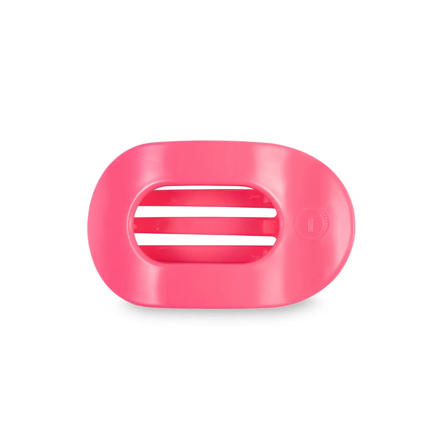 small flat round hair clip in a bright pink color