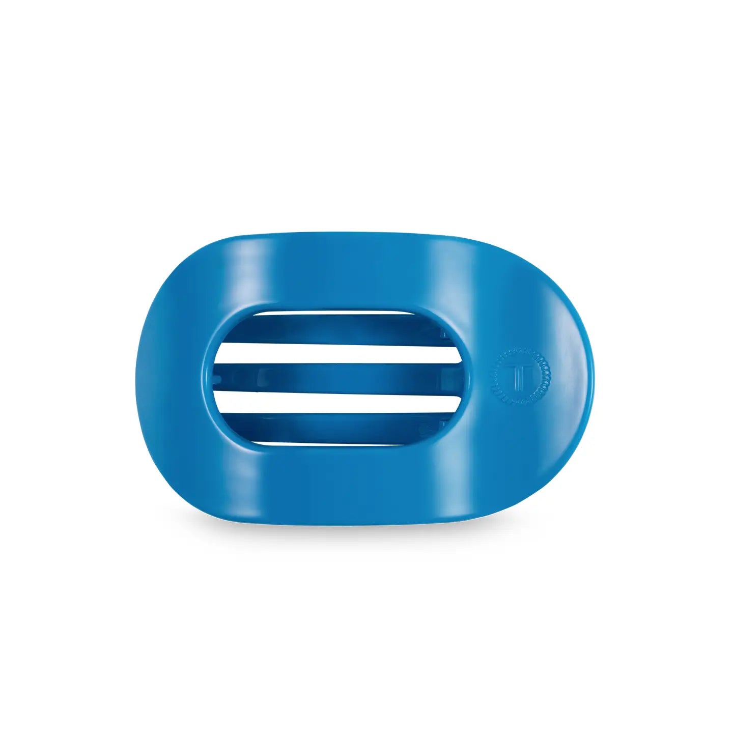 smal flat round hair clip in a bright blue color