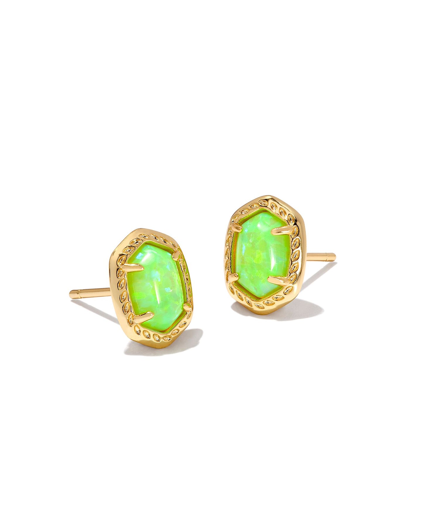 Gold stud earrings with a neon green stone.