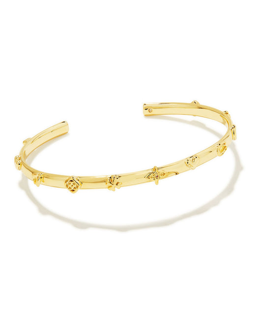 Meet the Beatrix Gold Cuff Bracelet in White Crystal, a contemporary take on the classic charm bracelet. Petite charms in horseshoe, clover, heart, moon, and our signature medallion shapes stud this cuff to create a look that’s sleek, chic, and totally unique. Adjustable and with just a touch of sparkle, we have a feeling this cuff will grace your bracelet stack time and time again.