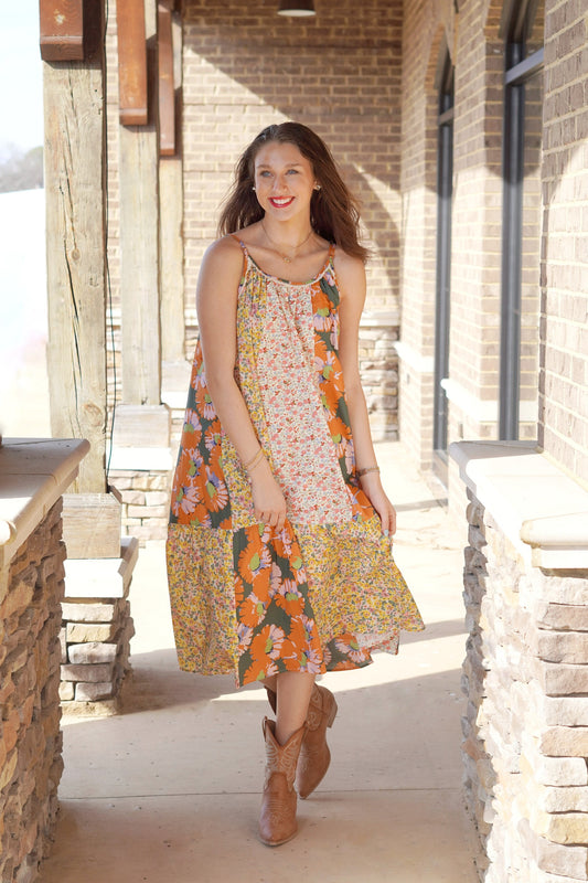<ul> <li>Payt Patchwork Floral Midi Dress</li> <li>Scoop Neckline w/ Lace Trim</li> <li>Adjustable Spaghetti Straps</li> <li>Bright Multi-Colored Floral Patchwork Design</li> <li>Midi Length</li> <li>Babydoll Fit</li> <li>Pockets</li> <li>100% Cotton</li> </ul>