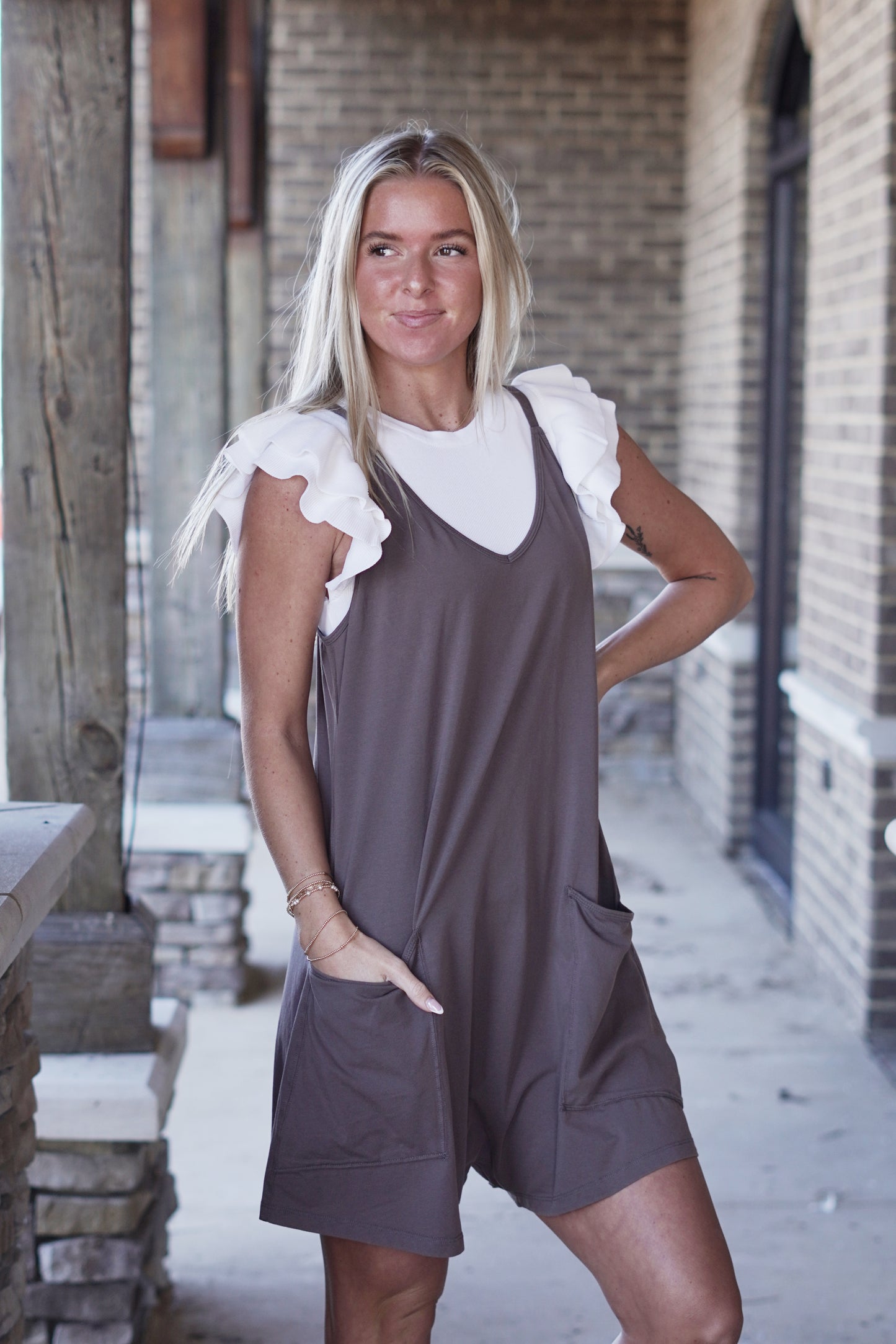 All Day Long Knit Romper V-Neckline Sleeveless Adjustable Spaghetti Straps Romper Style Pockets Color: Charcoal Relaxed Fit Shorts 93% Cotton, 7% Spandex