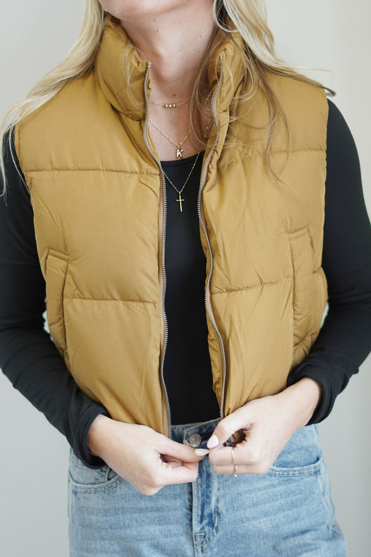 Cold Brew Cozy Puffer Collared Neckline Sleeveless Zipper Closure Color: Pale Brown Front Pockets Cropped 75% Polyester, 25% Nylon