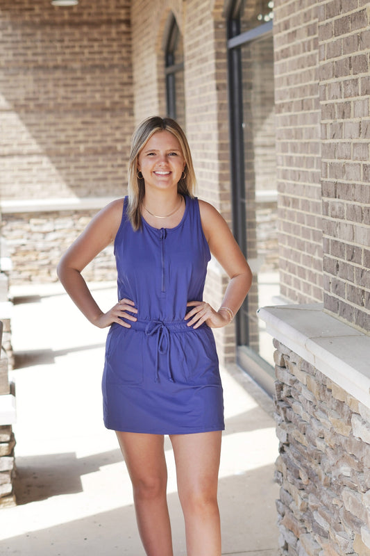 <ul> <li>So Soft Sleeveless Romper Dress</li> <li>Round Neckline</li> <li>Half Zip Up Closure</li> <li>Elastic Cinch Waistband</li> <li>String Tie Closure On Elastic Waistband</li> <li>Built In Pockets</li> <li>Built In Spandex Shorts</li> <li>Romper Dress</li> <li>Colors/ Blue</li> <li>Relaxed Fit</li> <li>Mid Thigh Length</li> <li>Butter Soft, Light Weight Material</li> <li>True To Size</li> <li>Fabric Content: 84% Poly Microfiber, 16% Spandex</li> </ul>