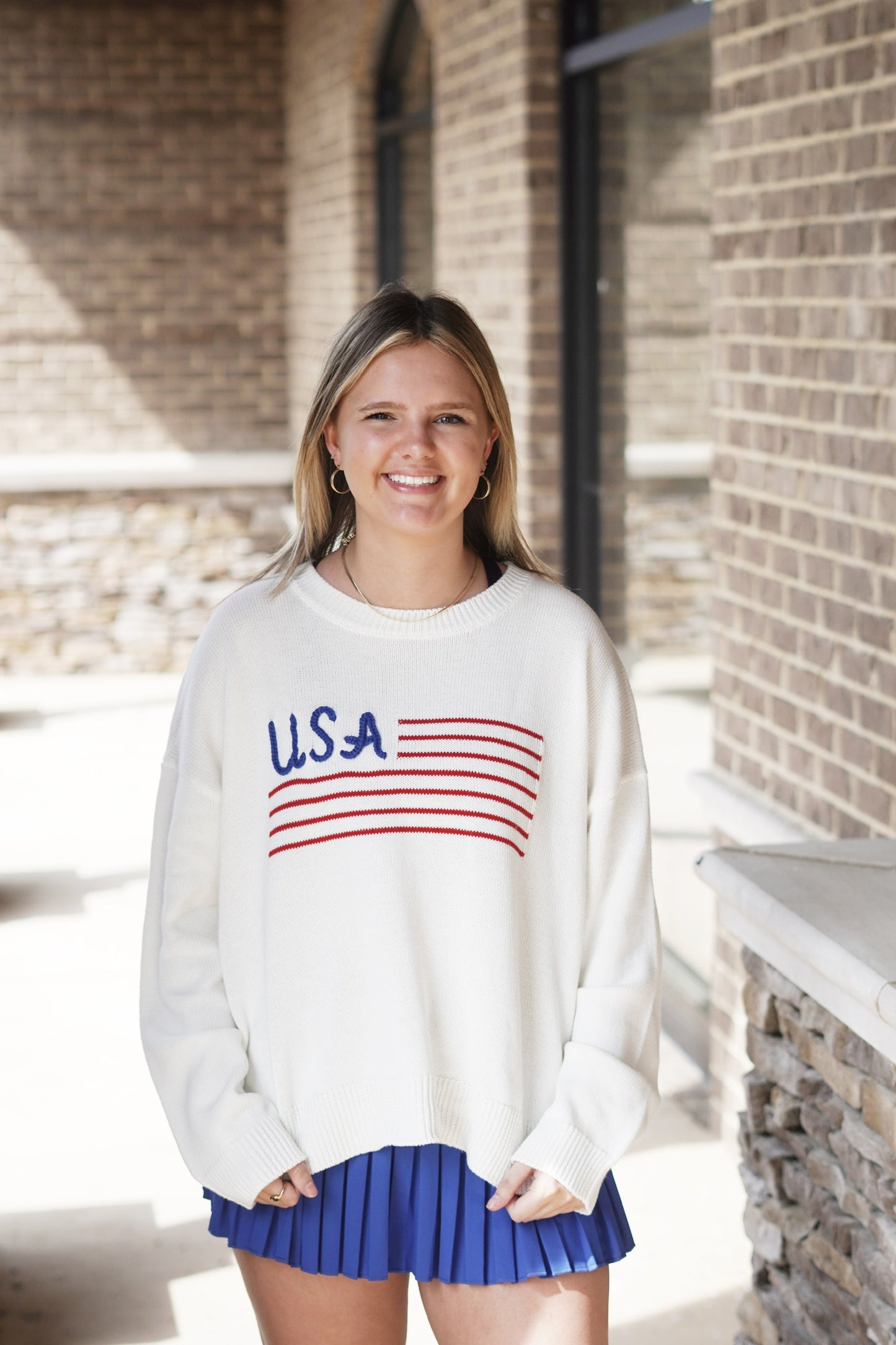 <ul> <li>USA Lightweight Sweater</li> <li>Round Neckline</li> <li>Long Sleeves</li> <li>Blue "USA" And Red Flag Design</li> <li>Sweater Color: White</li> <li>Light Weight, Loose Fit</li> <li>Full Length</li> <li>True To Size</li> <li>Knitted Fabric </li> <li>Fabric Content: 60% Cotton, 40% Acrylic</li> </ul>