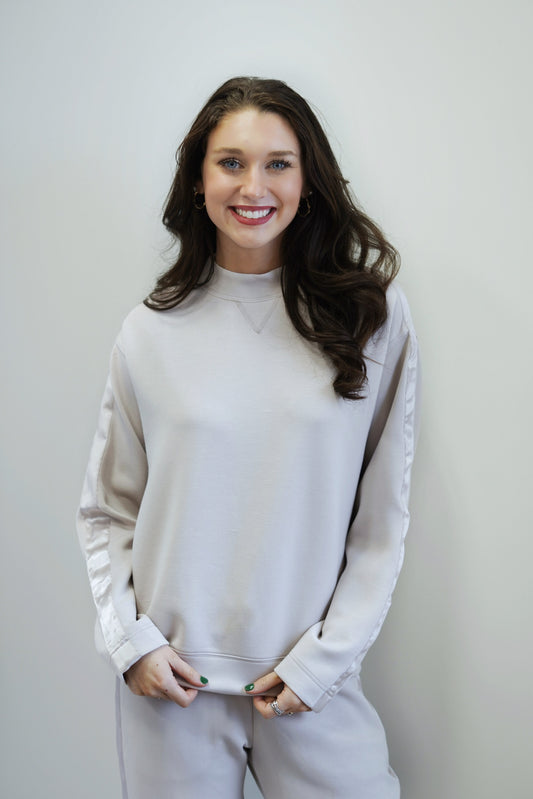 So Sleek Satin Trim Crew Neck Top Crew Neckline Long Sleeves Satin Trim on Sleeves Colors: Cream, Full Length Relaxed Fit 48% Modal, 46% Polyester, 6% Spandex