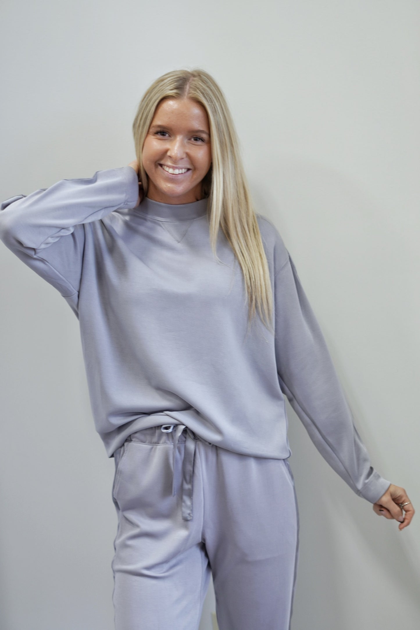 So Sleek Satin Trim Crew Neck Top Crew Neckline Long Sleeves Satin Trim on Sleeves Colors: Mystic Grey Full Length Relaxed Fit 48% Modal, 46% Polyester, 6% Spandex