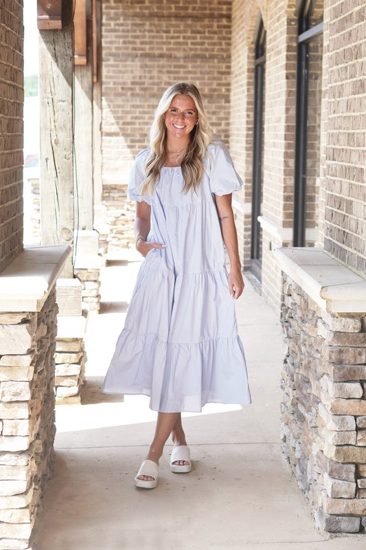 Pretty Sweet Puff Sleeve Tiered Midi Dress Square Neckline Elastic Neckline Short Puff Sleeves w/ Ties Tiered Style Color: Light Blue Midi Length Relaxed Fit 100% Cotton
