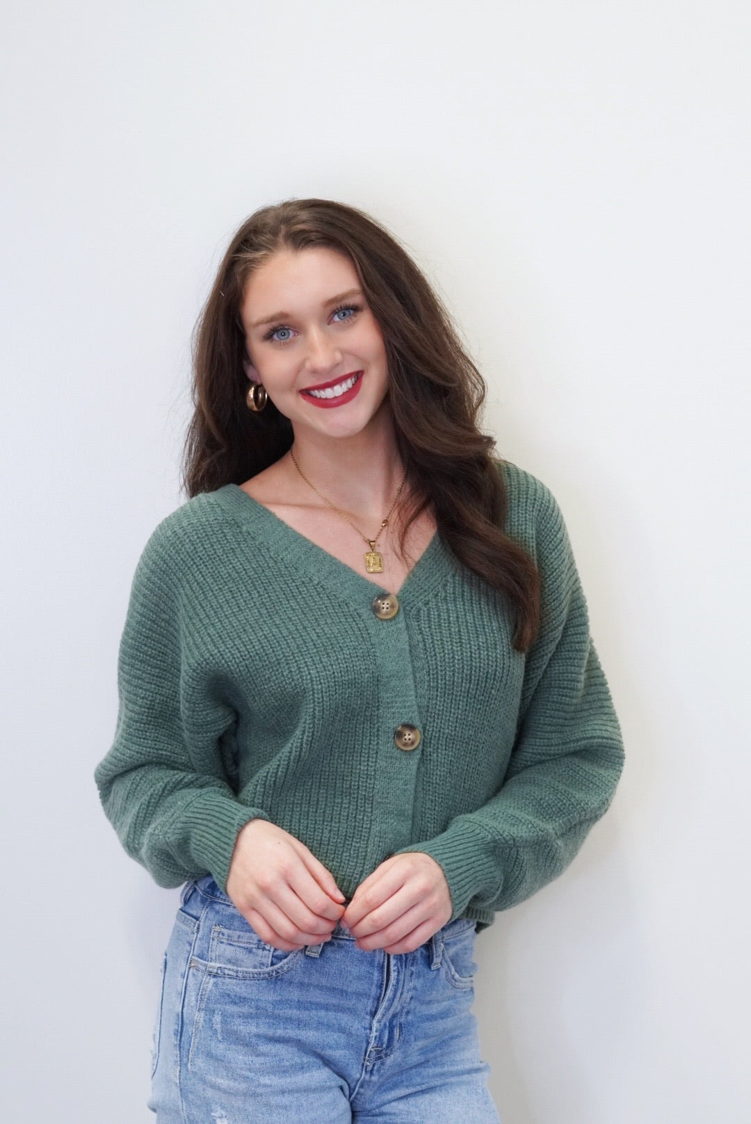 Cover Me Up Cardigan V-Neckline Long Cuffed Sleeves Brown Buttons Color: Forest Green Skimmer Length Relaxed Fit 100% Polyester