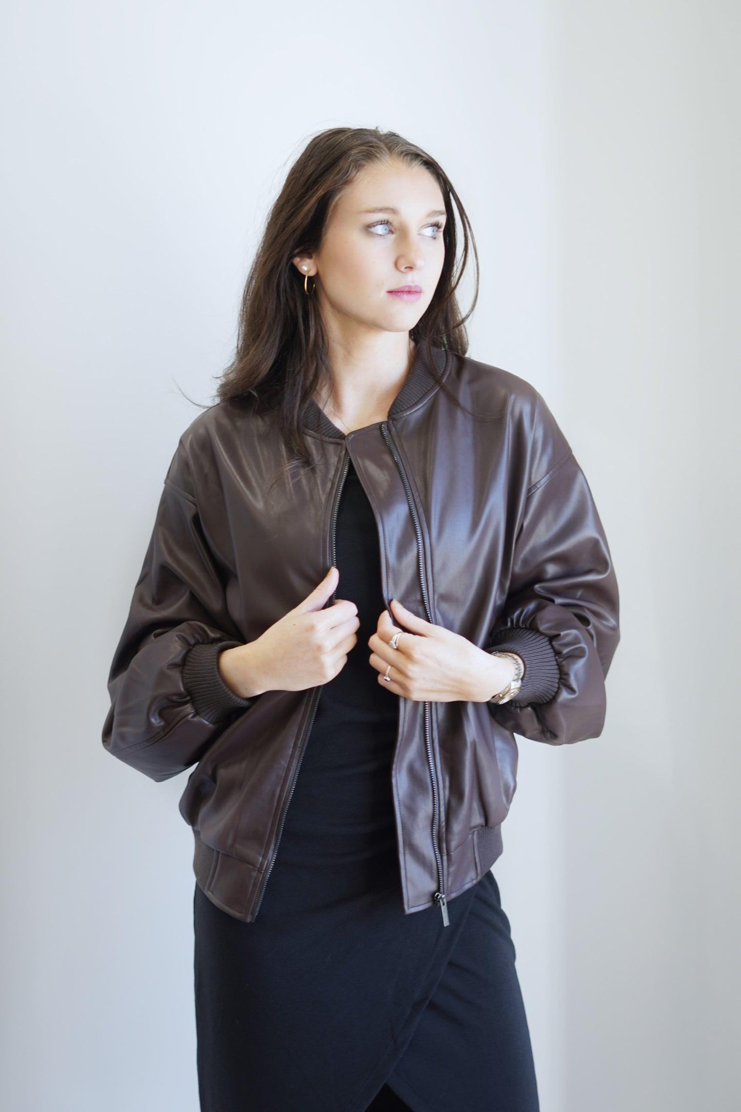 Francy Faux Leather Bomber Jacket Crew Ribbed Neckline Long Cuffed Sleeves Ribbed Cuffed Hem Colors: Brown Zipper Closure Bomber Jacket Style Front Pockets 97% Polyester, 3% Spandex