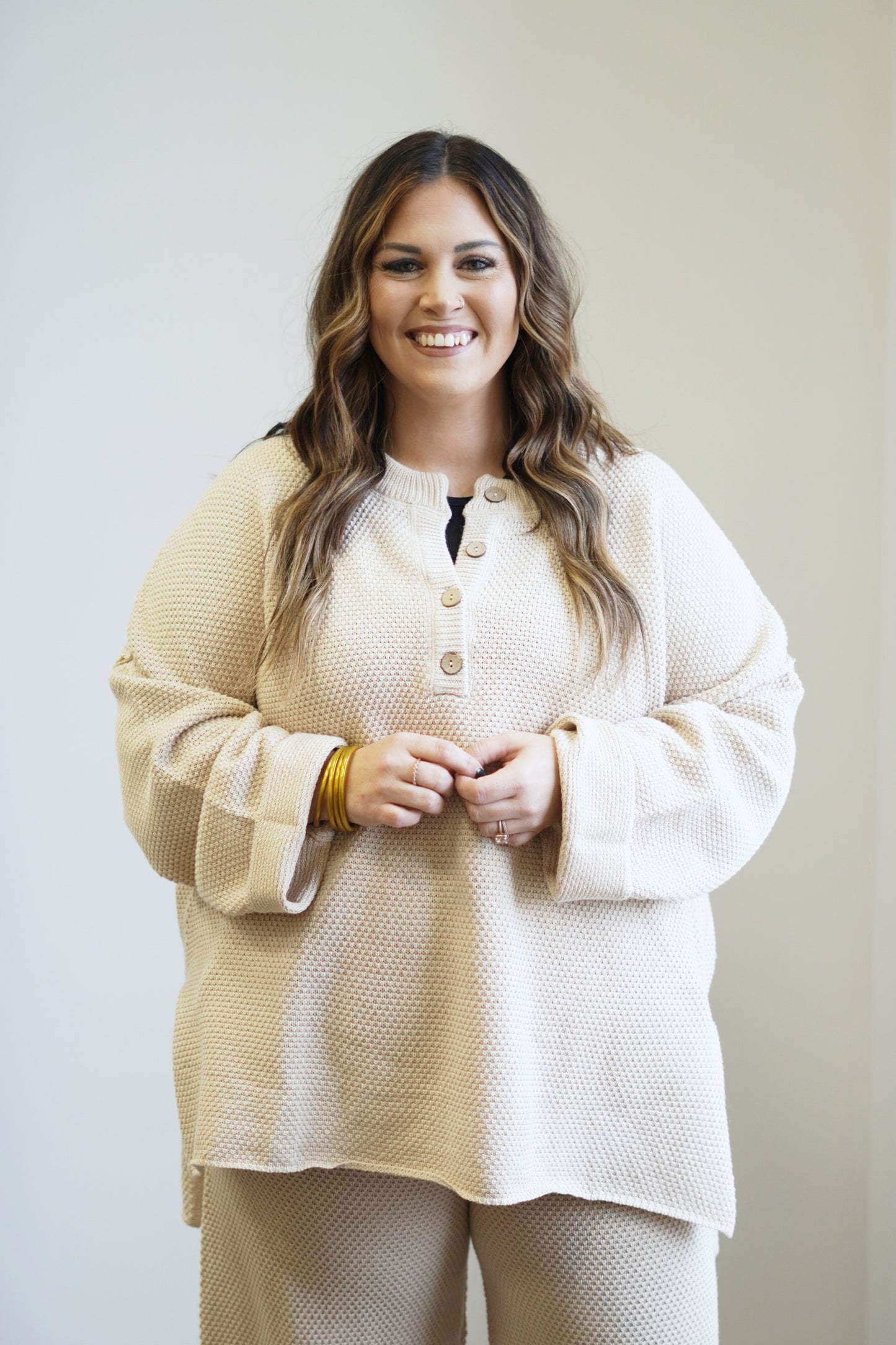 Honey Oversized Henley Sweater Top Henley Neckline w/ Functional Buttons Long Sleeve High Low Hem w/ Side Slits Colors: Sand Relaxed Fit 55% Acrylic, 45% Cotton Care: Hand Wash Cold, Do Not Bleach, Hang to Dry