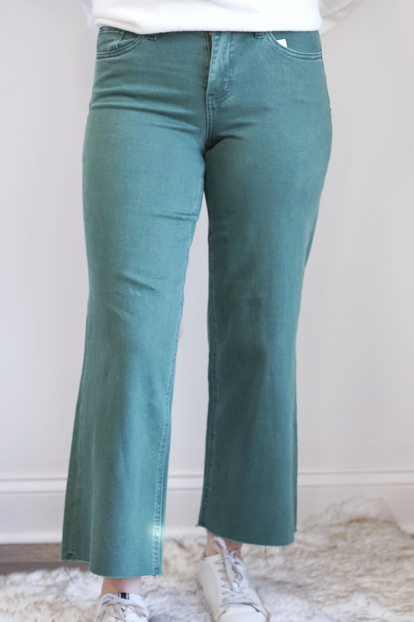 Callie Cropped Wide Leg jeans Closure: Zipper Fly Mid Rise Cropped Length Wide Leg Fit Raw Hem Color: Mallard Green 94% Cotton, 4% Polyester, 2% Spandex