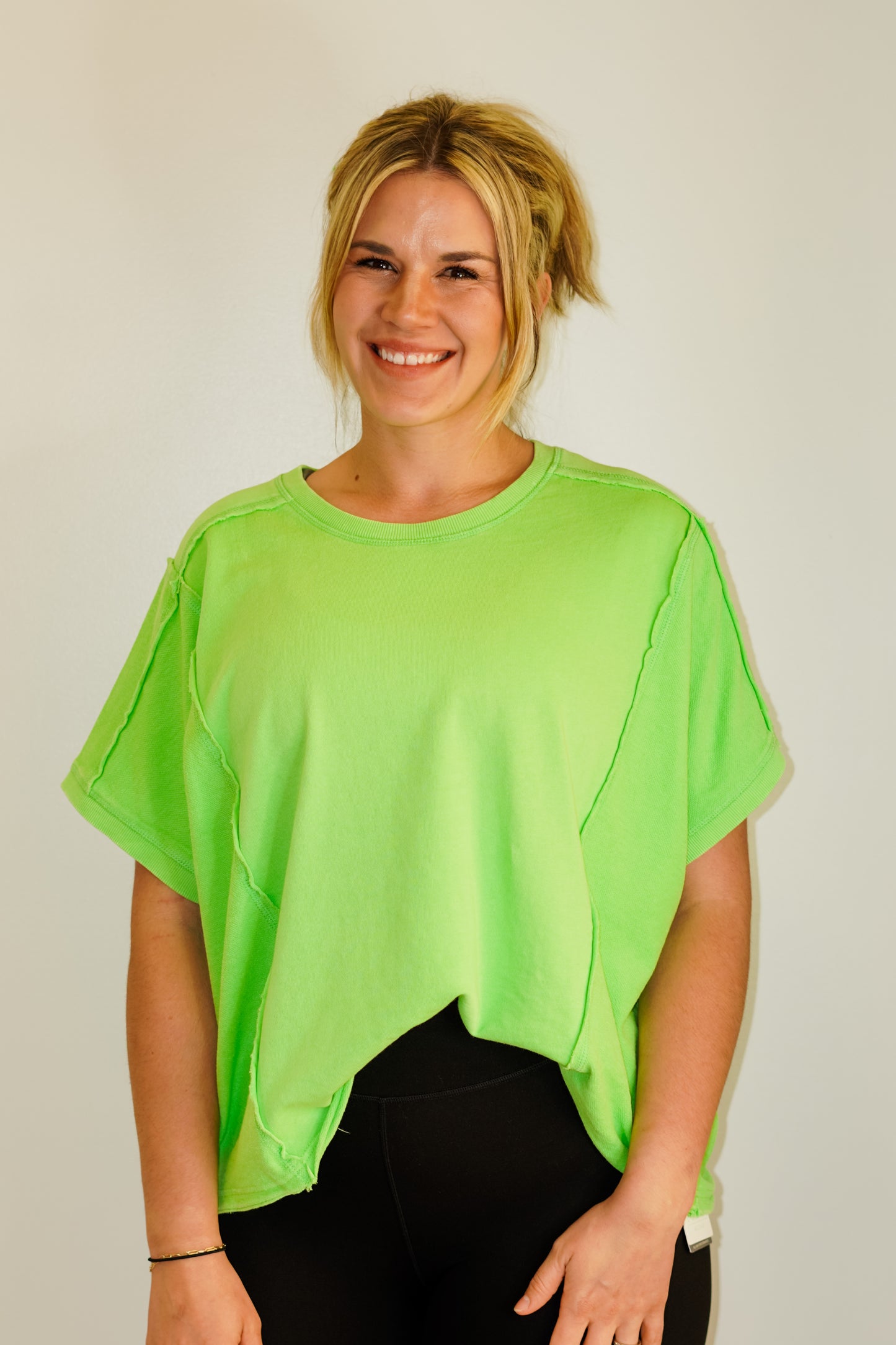 Mollie Mineral Wash Top Short Sleeved Available in Purple and Lime 95% Cotton 5% Spandex Hand Wash Cold, Water Separately, Do Not Bleach, Hang To Dry Model is wearing size medium