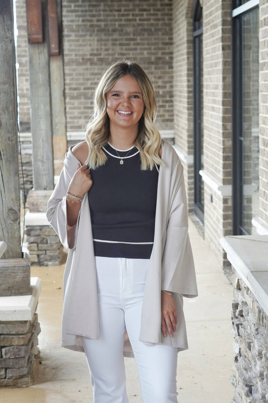 Casual and Cozy Oversized Cardigan 3/4" Sleeves Mid-Thigh Length Oversized Fit Lapel Detail Open Front 50% Rayon, 45% Polyester, 5% Spandex taupe color