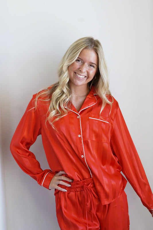 Collared Neckline Long Sleeves Front Pocket Two Toned Stripes White Trim White Buttons Colors: Red, Relaxed Fit Full Length 100% Polyester