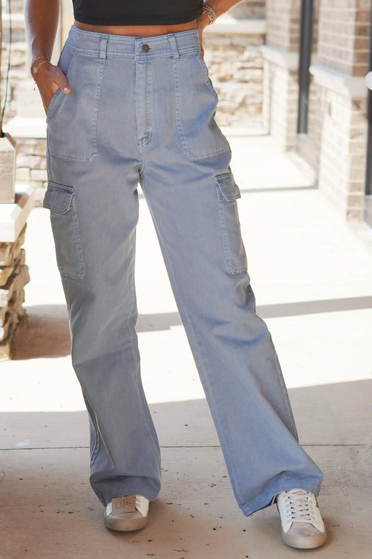 Calli Cargo Wide Leg Jeans Wide Leg Jeans Button/Zip closure Full Length Inseam: 29" Side Pockets Colors: Gray Blue Fabric Content: 100% Cotton
