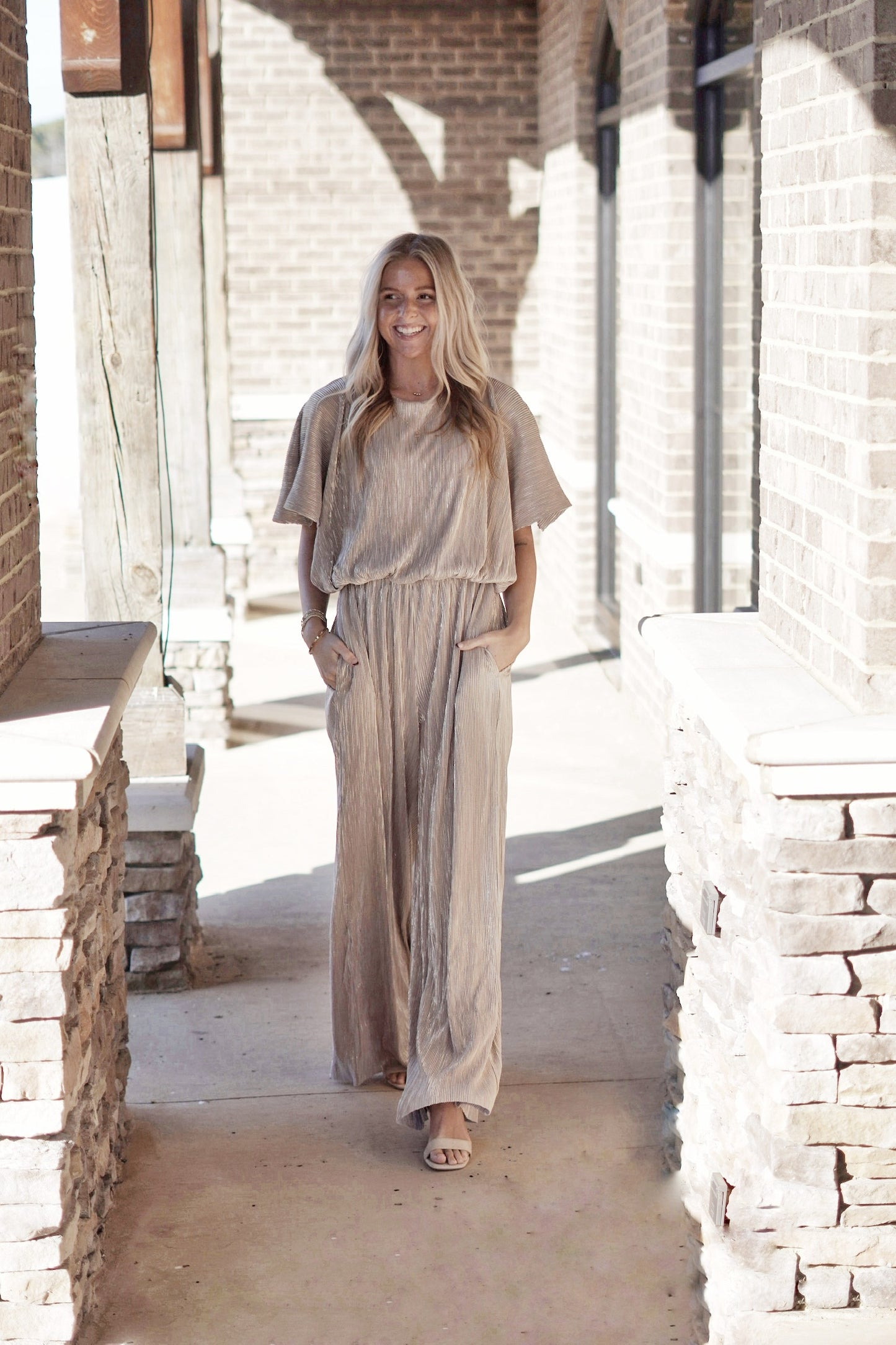 Gal in Gold Metallic Wide Leg Jumpsuit High Round Neckline Short Flutter Sleeves Cinched Waist Full Length Wide Legs Color: Metallic Silver and Gold 100% Polyester